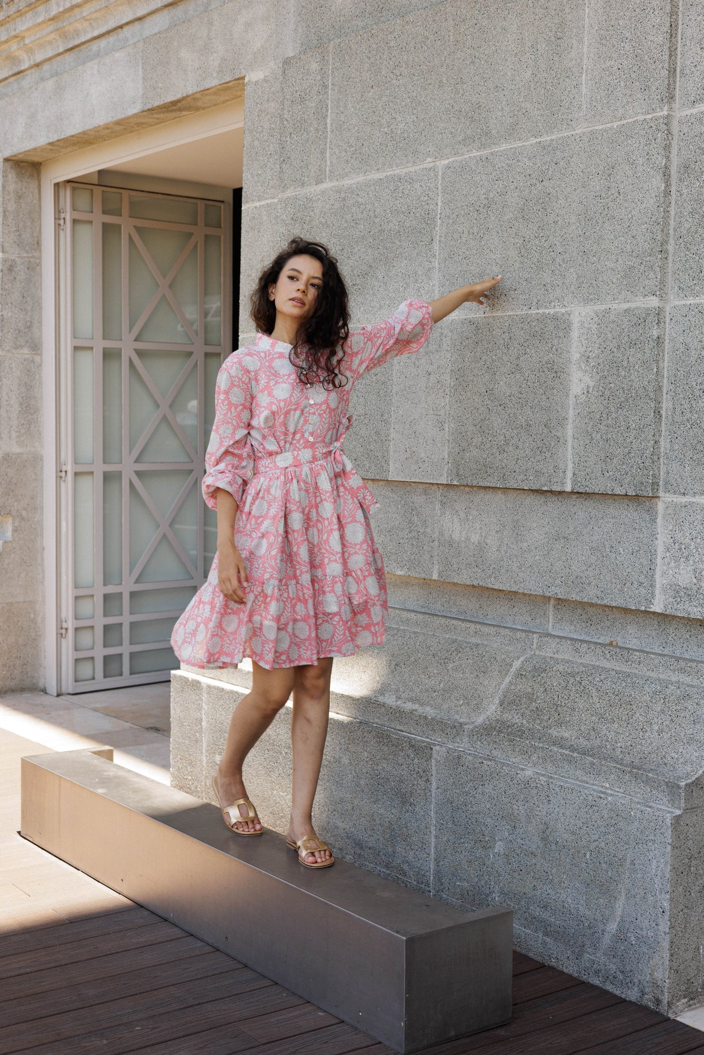 Resort-ready peach mini dress in breathable cotton with romantic floral block print details