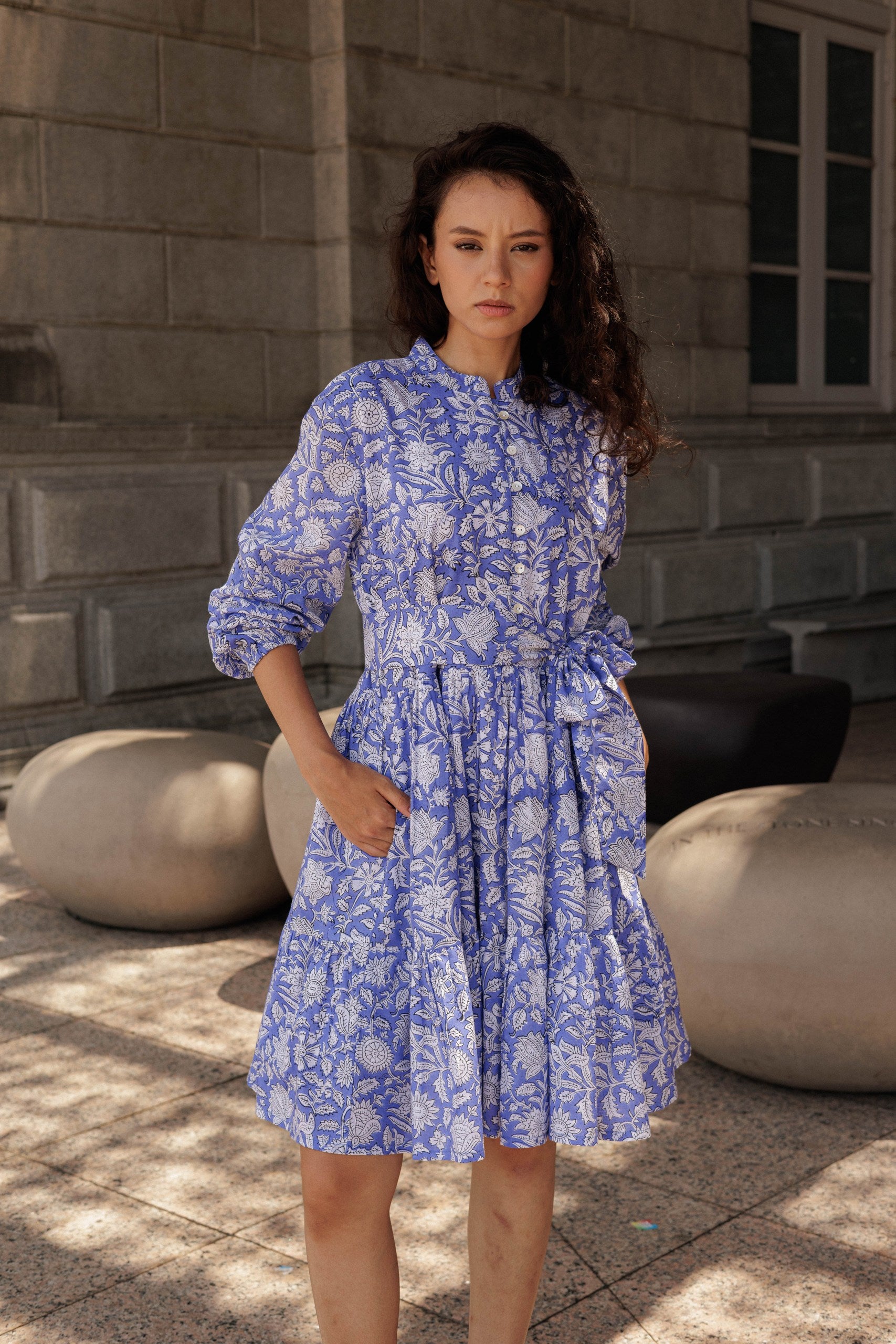 Handcrafted cotton mini dress in lavender featuring artisanal block printing and a relaxed feminine fit.