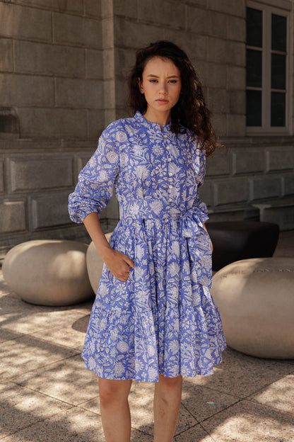 Handcrafted cotton mini dress in lavender featuring artisanal block printing and a relaxed feminine fit.
