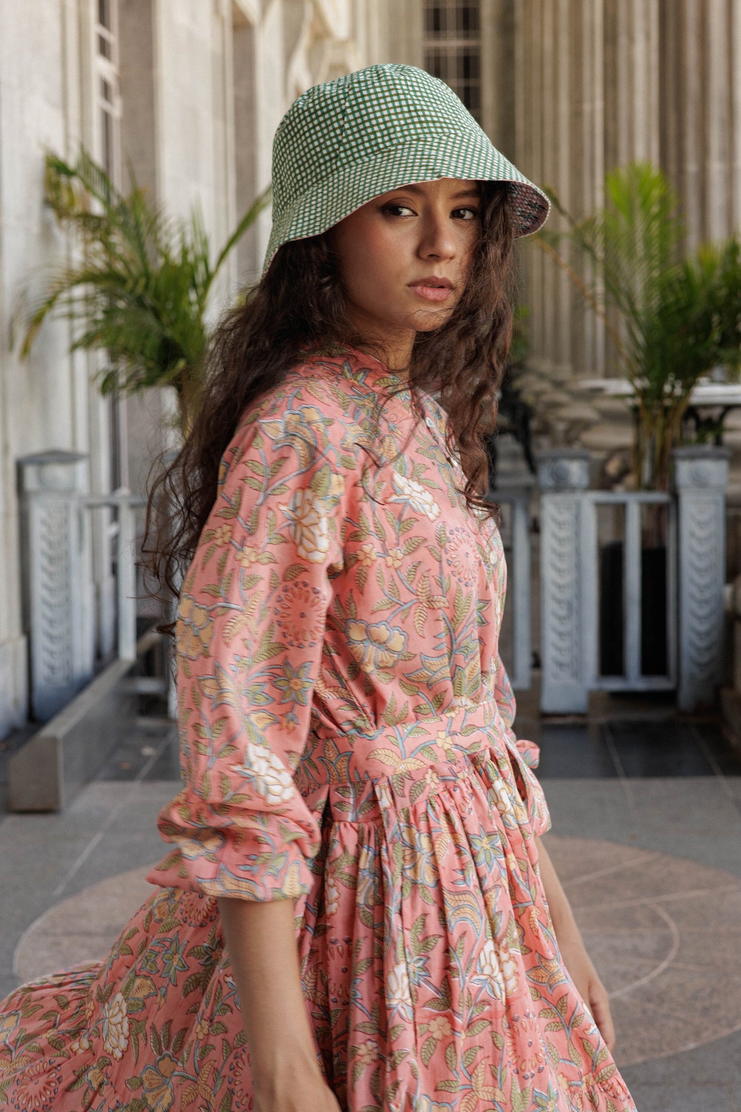 Hand made cotton bucket hat with Jaipur Pink floral print and contrasting Holly reverse