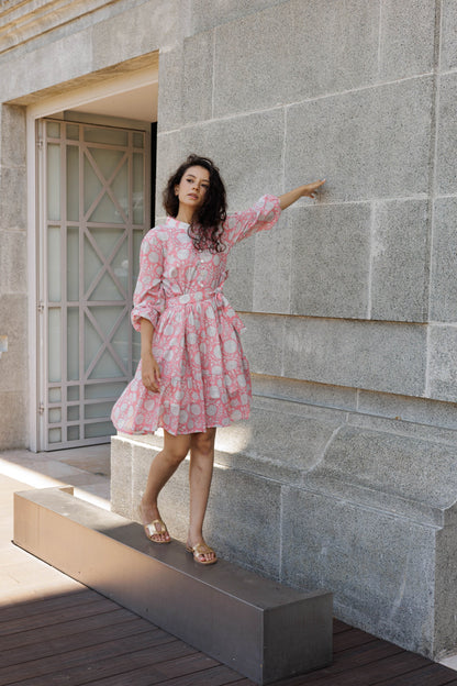 Resort-ready peach mini dress in breathable cotton with romantic floral block print details