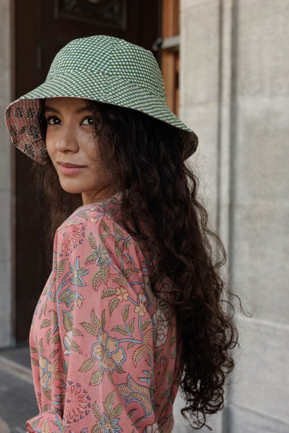 Reversible Artful House bucket hat in breathable block printed cotton with floral motifs